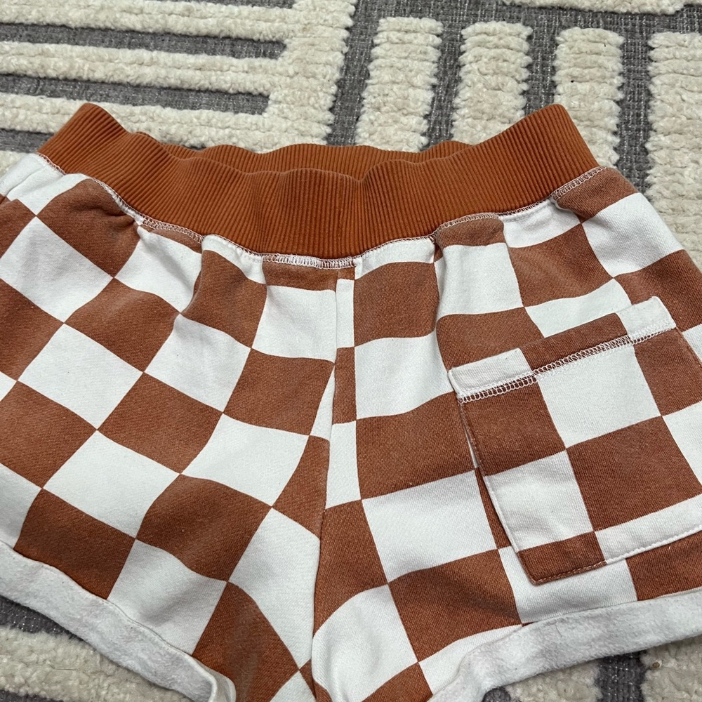 Out from under checkered shorts - Picture 10 of 11